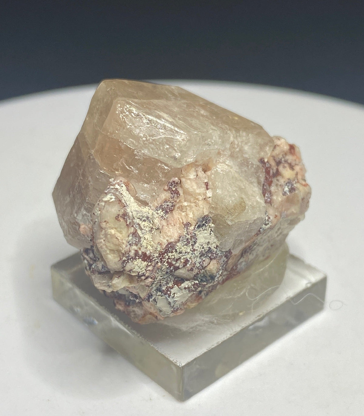 Pale peach apatite crystal from Divino das Laranjeiras, Minas Gerais, Brazil