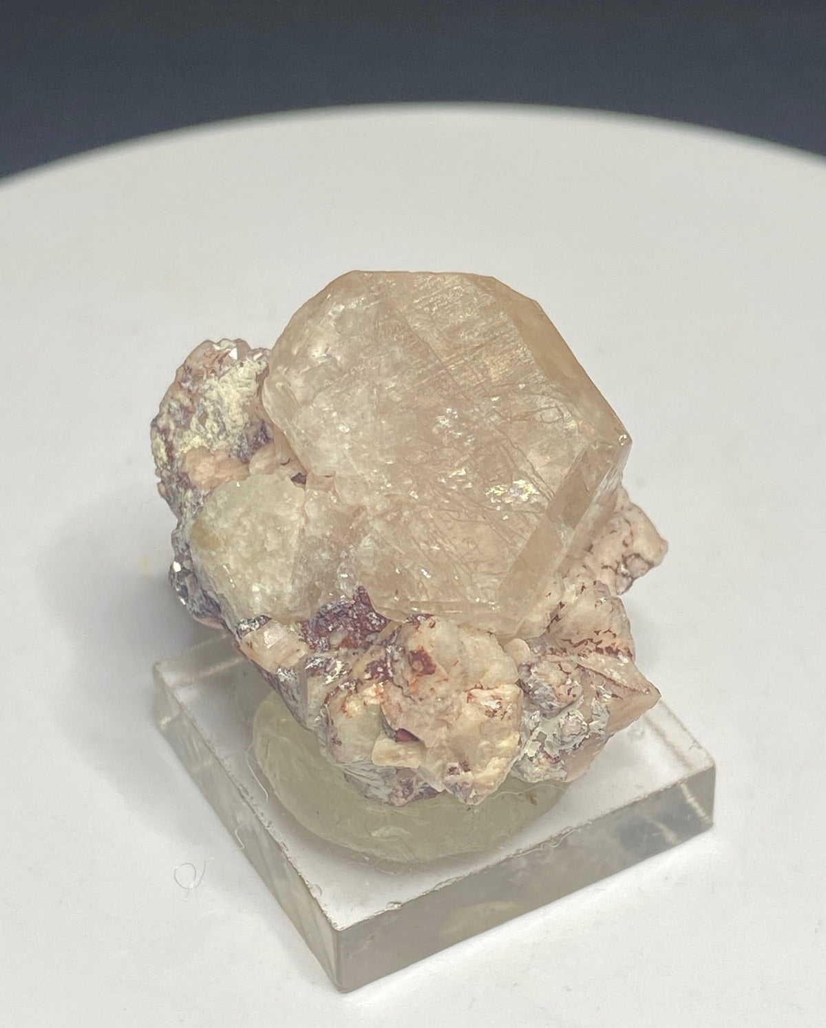 Pale peach apatite crystal from Divino das Laranjeiras, Minas Gerais, Brazil