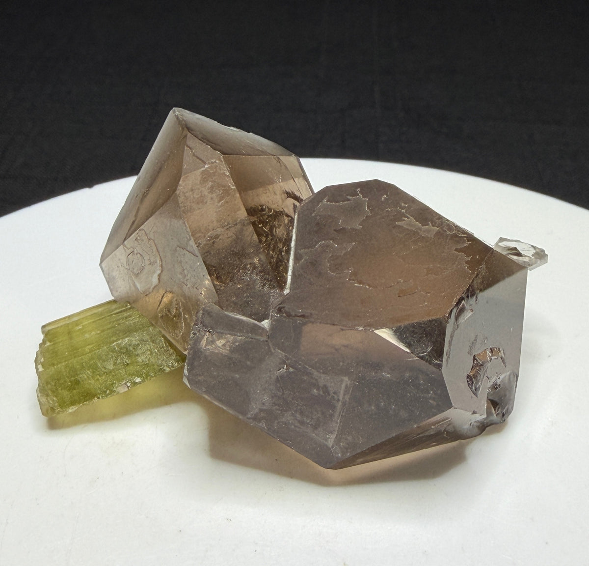 Green elbaite tourmaline crystal on smoky quartz from Paprok, Afghanistan