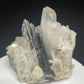 Dark bladed hübnerite crystals on clear quartz from Pasto Bueno, Pallasca Province, Ancash, Peru