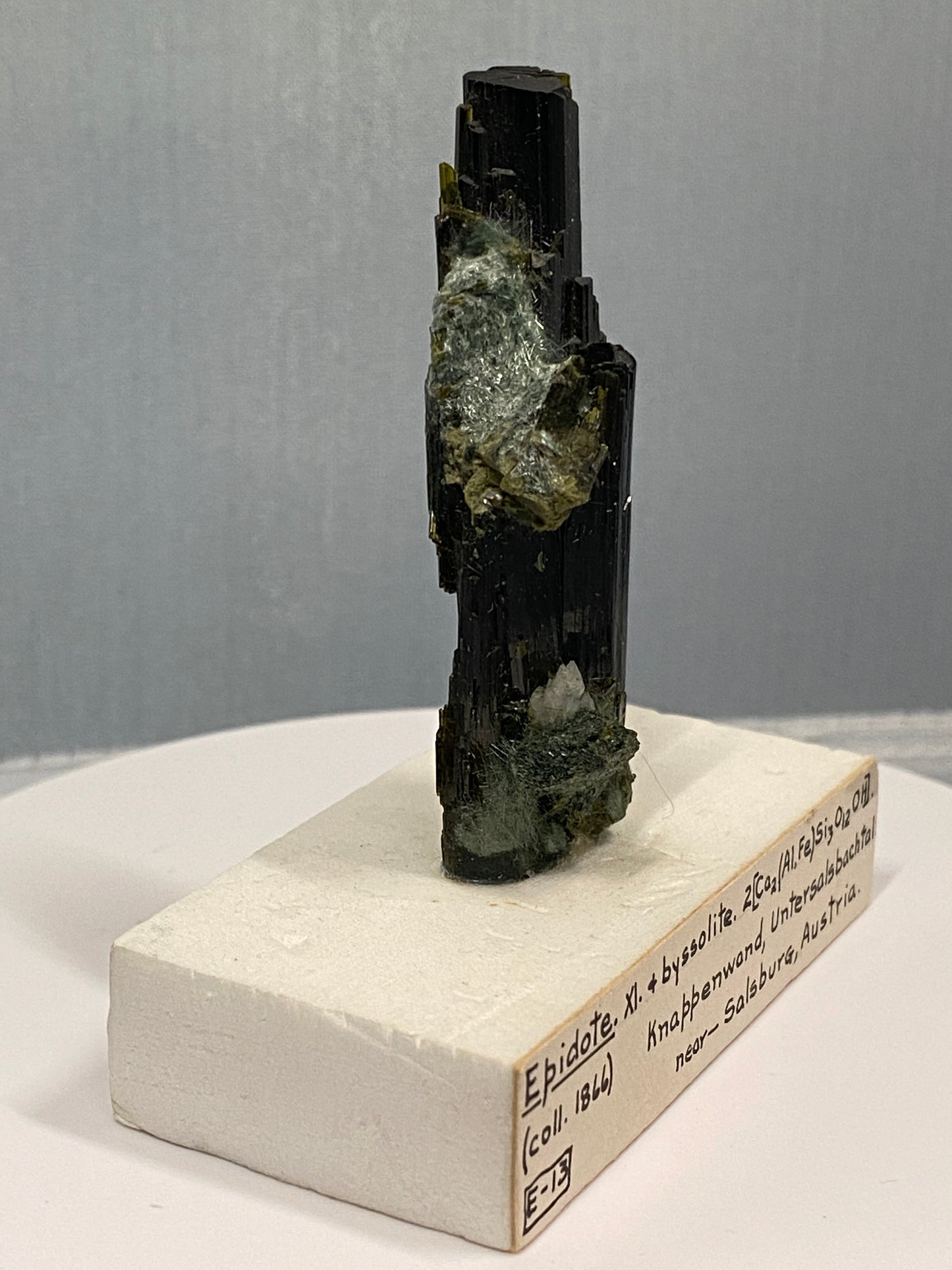 Epidote (bent crystal), Knappenwand, Untersalsbachtal, near Salsburg, Austria (ex-Smithsonian) - Collected 1866