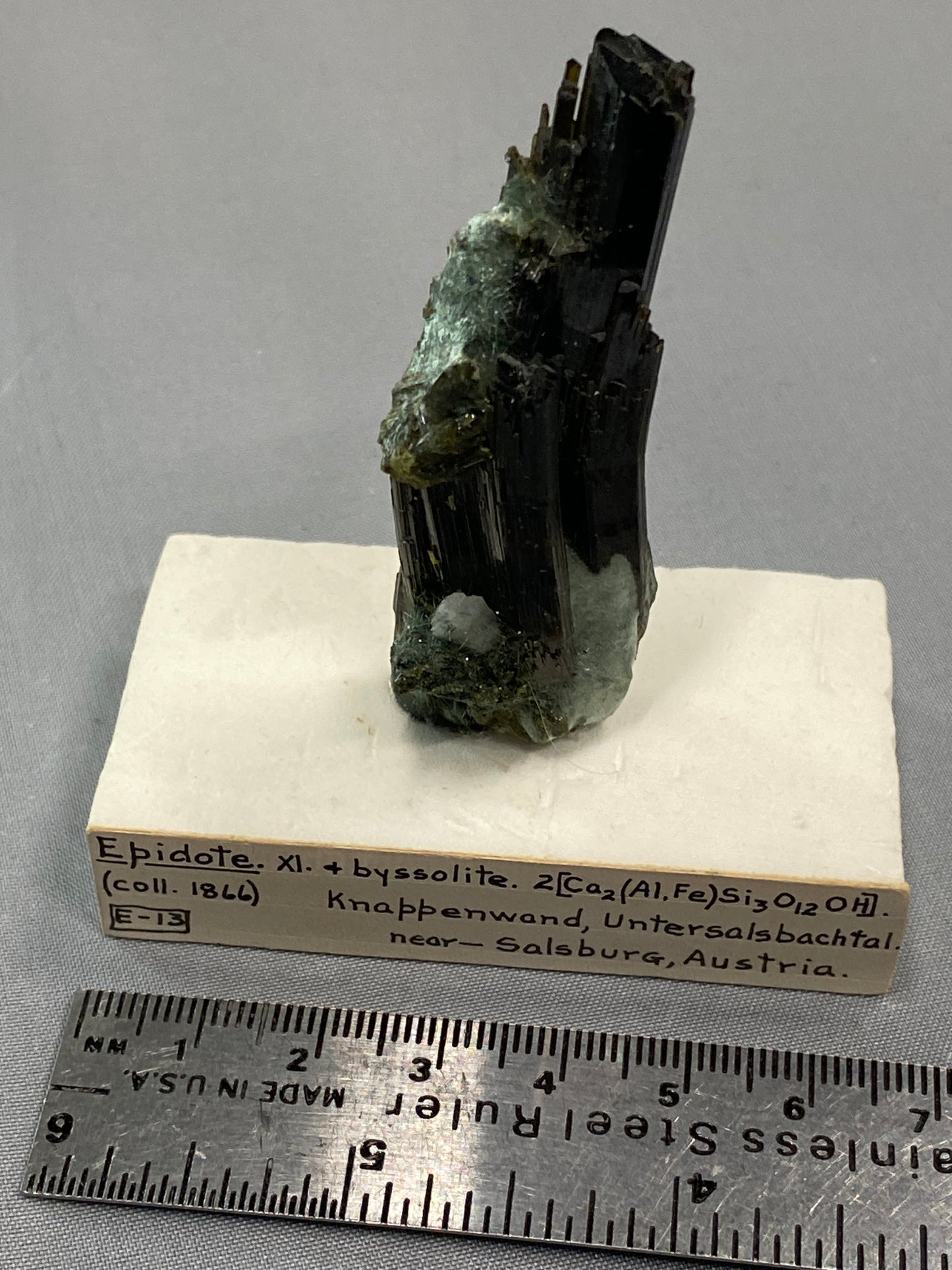 Epidote (bent crystal), Knappenwand, Untersalsbachtal, near Salsburg, Austria (ex-Smithsonian) - Collected 1866