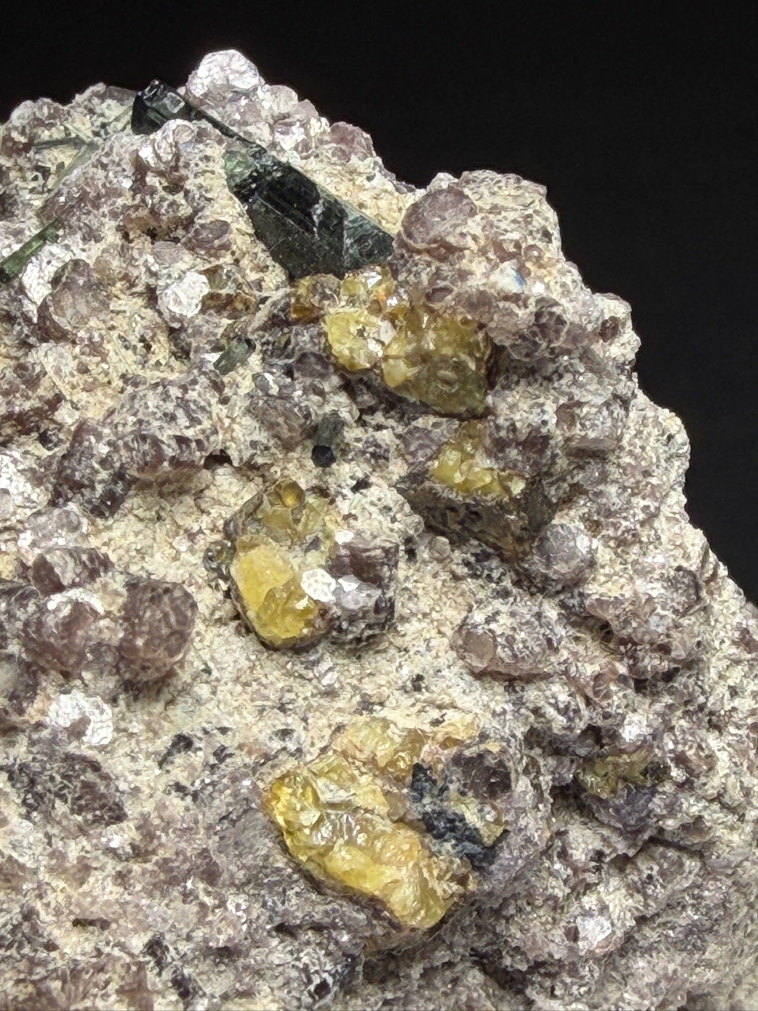 Microlite and black cassiterite with tourmaline on purple lepidolite from Virgem da Lapa, Minas Gerais, Brazil