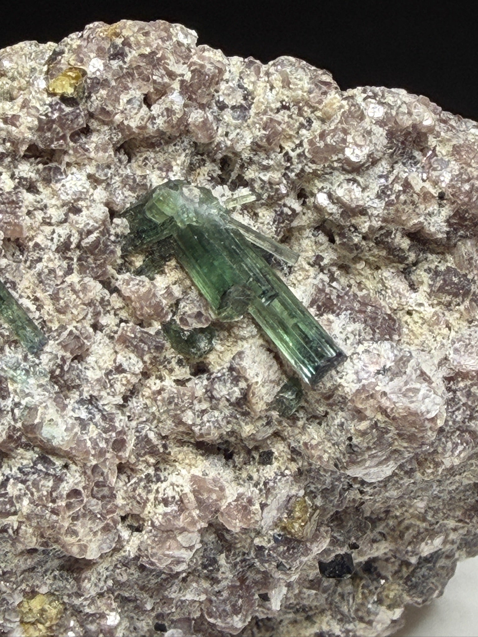 Microlite and black cassiterite with tourmaline on purple lepidolite from Virgem da Lapa, Minas Gerais, Brazil