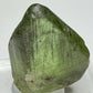 Bright green peridot olivine crystal with ludwigite inclusions from Sapat Gali, Pakistan