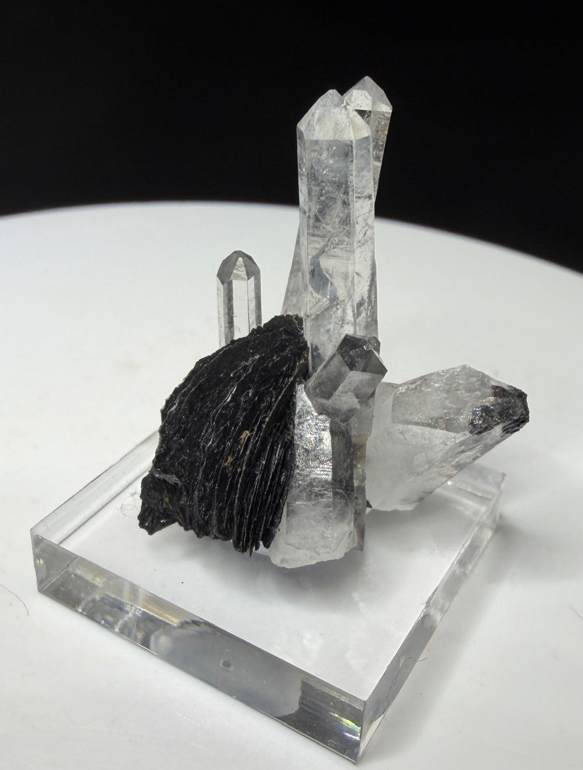 Clear quartz crystals with dark platy hematite from Jinlong Hill, Heyuan, Guangdong, China