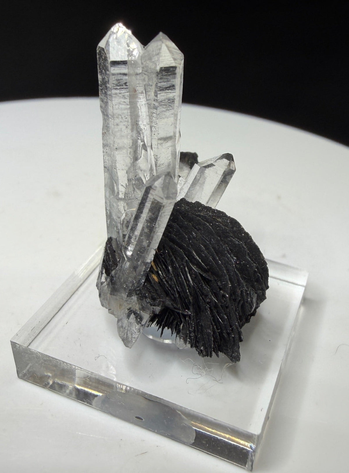 Clear quartz crystals with dark platy hematite from Jinlong Hill, Heyuan, Guangdong, China