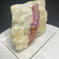 Pinkish red ruby crystal in white marble from Dattaw Mine, Mogok, Myanmar