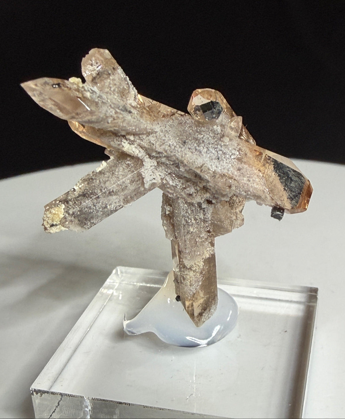 Champagne-colored topaz crystal cluster with bixbyite from Topaz Mountain, Thomas Range, Utah