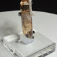Sherry-colored topaz crystal with black bixbyite crystals from Topaz Mountain, Thomas Range, Utah, USA