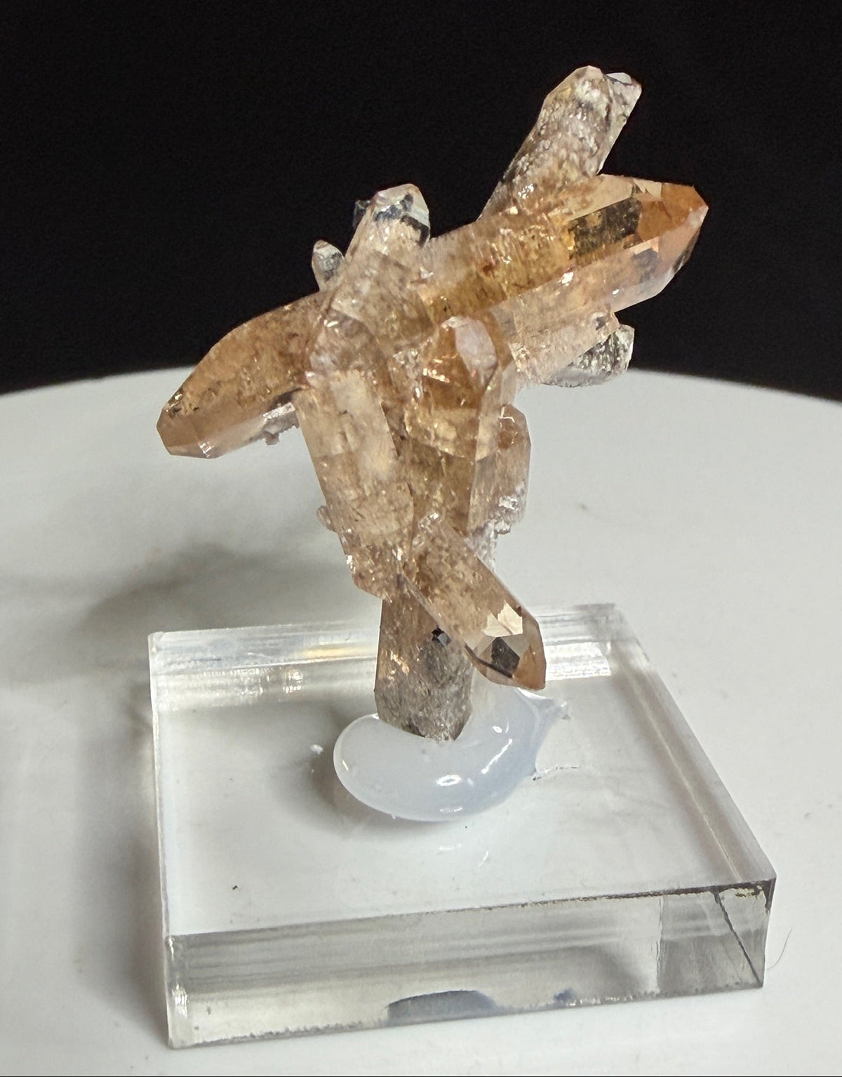 Champagne-colored topaz crystal cluster with bixbyite from Topaz Mountain, Thomas Range, Utah