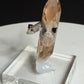 Sherry-colored topaz crystal with black bixbyite crystals from Topaz Mountain, Thomas Range, Utah, USA