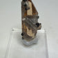 Sherry-colored topaz crystal with black bixbyite crystals from Topaz Mountain, Thomas Range, Utah, USA