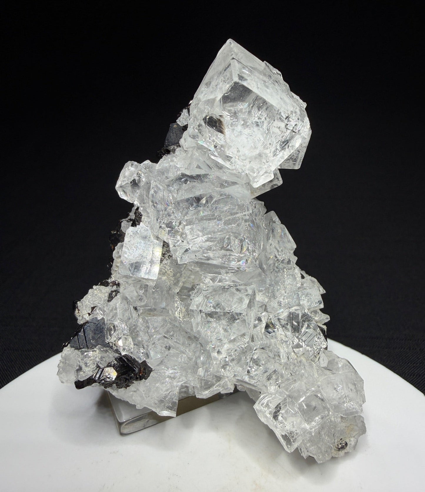 Colourless fluorite crystal cluster on dark matrix from the Nikolaevskiy Mine in Dalnegorsk, Russia