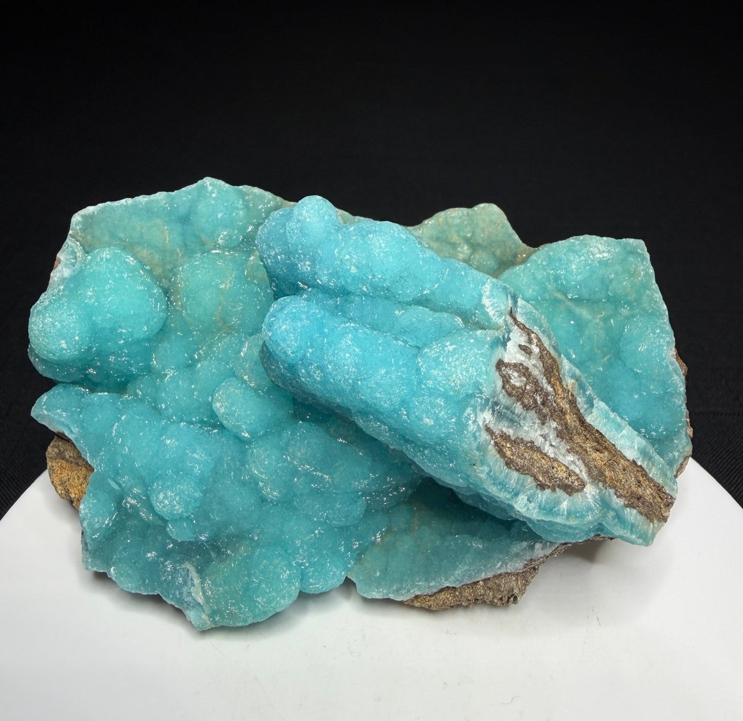 Turquoise-blue botryoidal hemimorphite on brown matrix from the Wenshan Mine in Yunnan, China