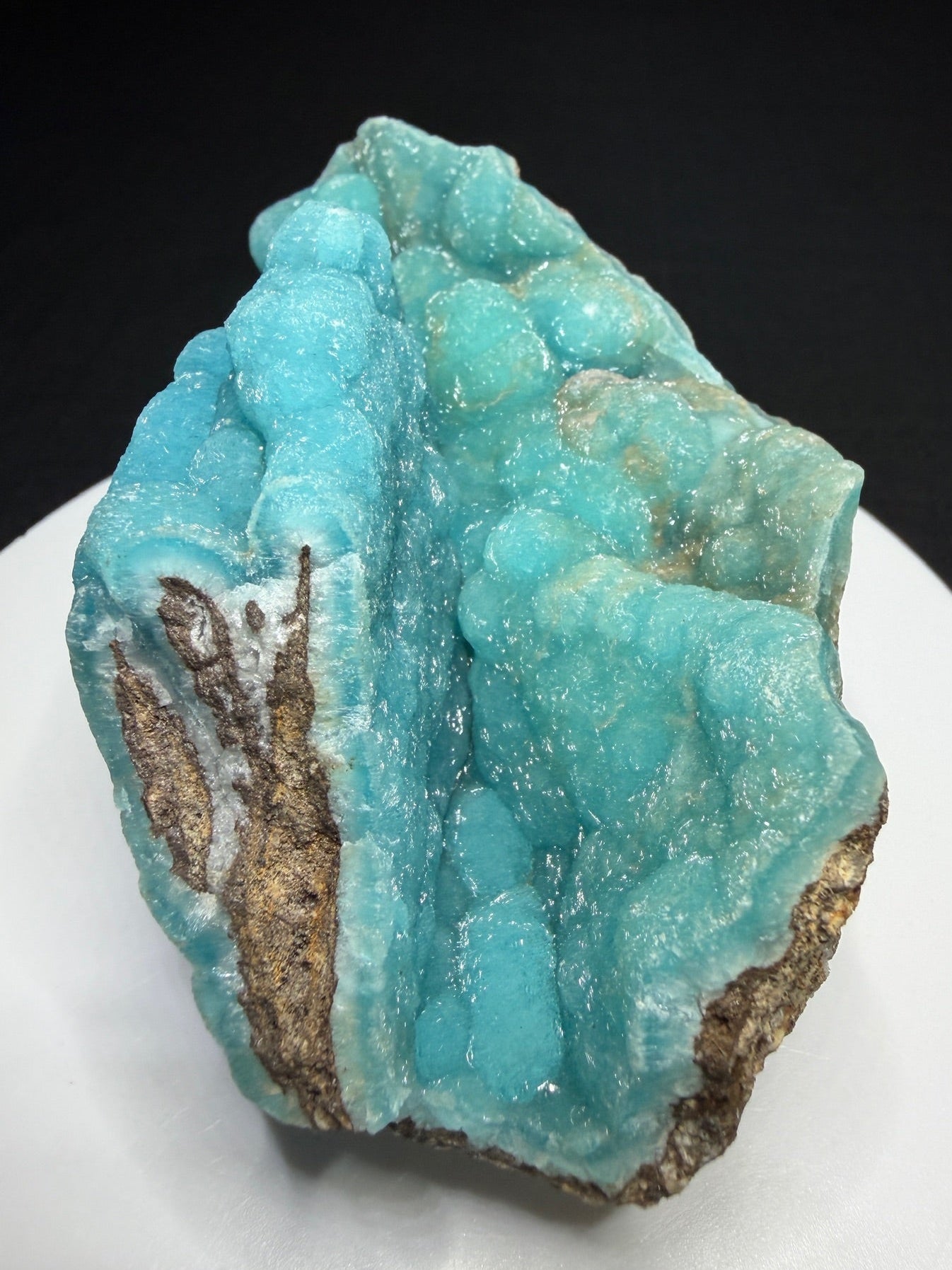 Turquoise-blue botryoidal hemimorphite on brown matrix from the Wenshan Mine in Yunnan, China