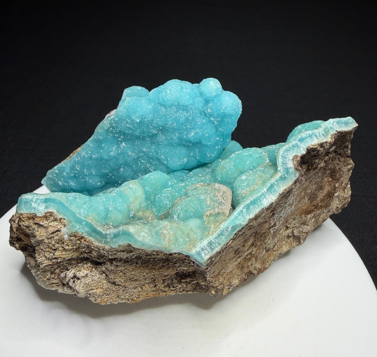 Turquoise-blue botryoidal hemimorphite on brown matrix from the Wenshan Mine in Yunnan, China