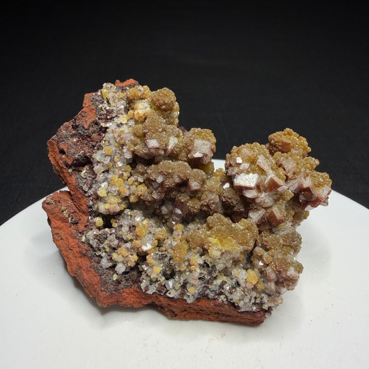 Golden-yellow mimetite crystals on pale pink calcite from the Santa Eulalia Mining District, Chihuahua, Mexico.