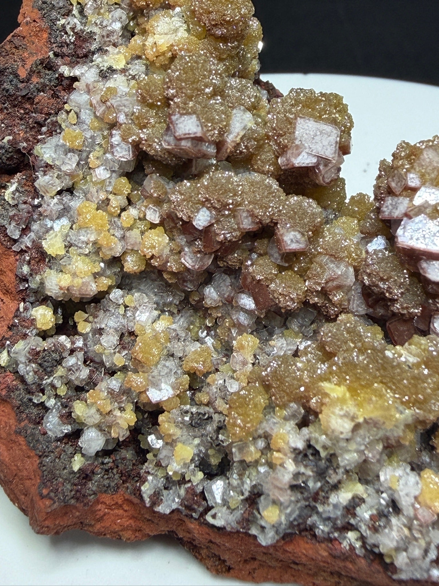 Golden-yellow mimetite crystals on pale pink calcite from the Santa Eulalia Mining District, Chihuahua, Mexico.