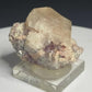 Pale peach apatite crystal from Divino das Laranjeiras, Minas Gerais, Brazil