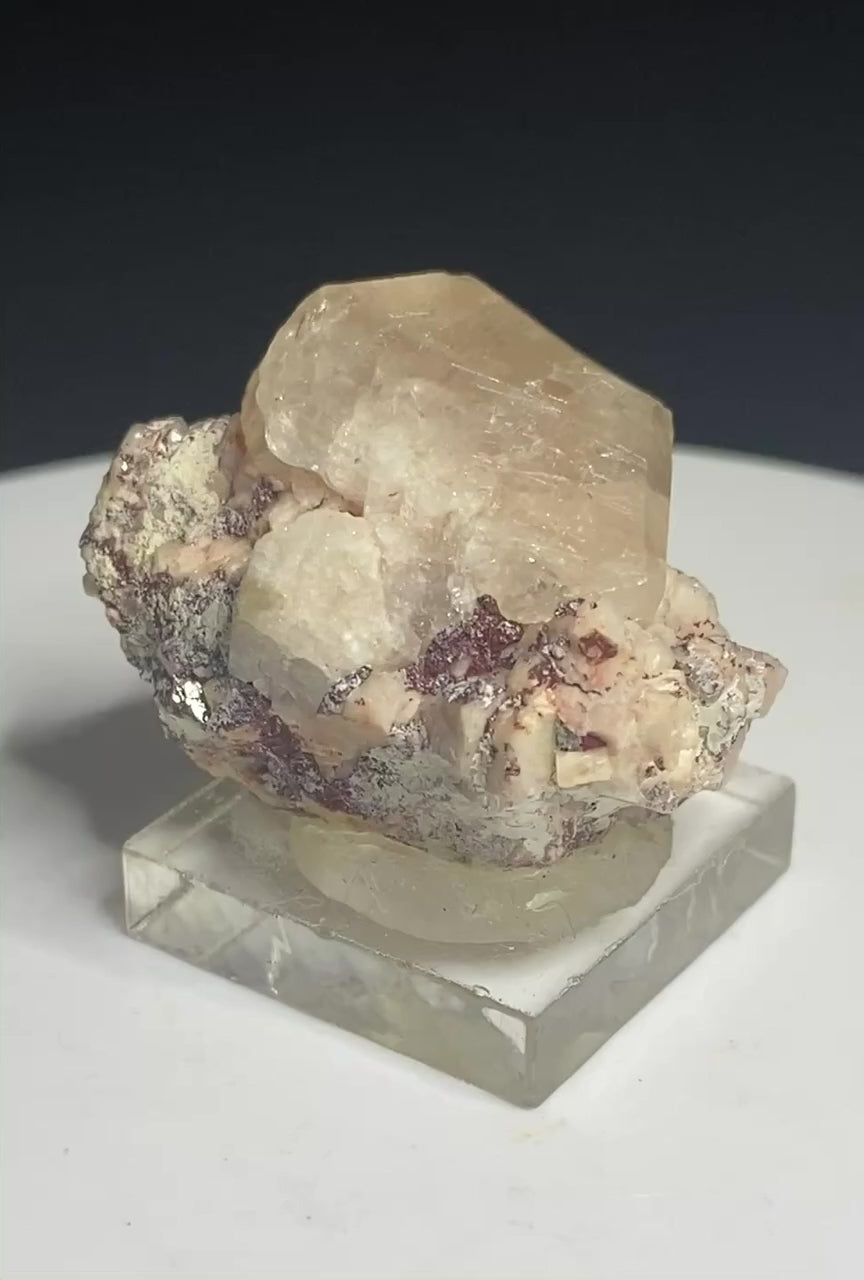 Pale peach apatite crystal from Divino das Laranjeiras, Minas Gerais, Brazil