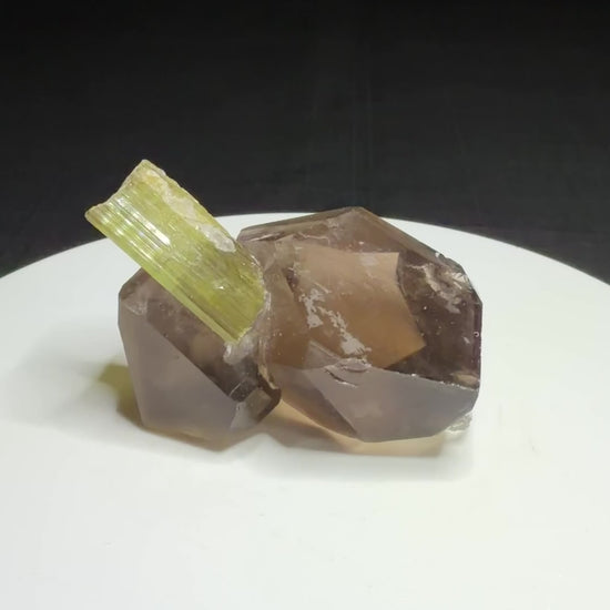 Green elbaite tourmaline crystal on smoky quartz from Paprok, Afghanistan