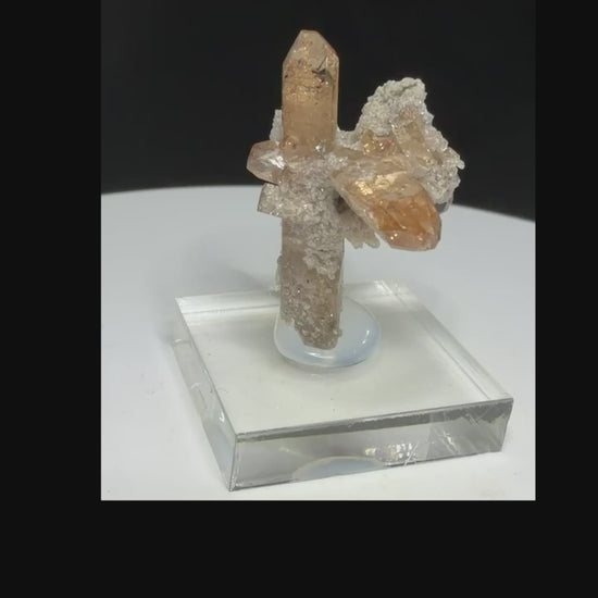 Sherry-colored topaz crystal with black bixbyite crystals from Topaz Mountain, Thomas Range, Utah, USA