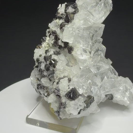 Colourless fluorite crystal cluster on dark matrix from the Nikolaevskiy Mine in Dalnegorsk, Russia
