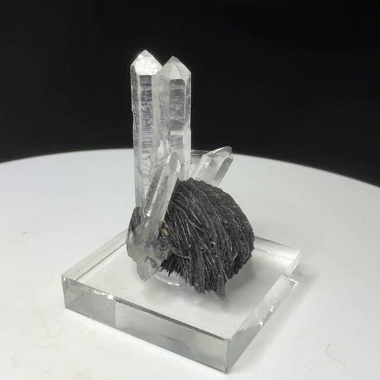 Clear quartz crystals with dark platy hematite from Jinlong Hill, Heyuan, Guangdong, China
