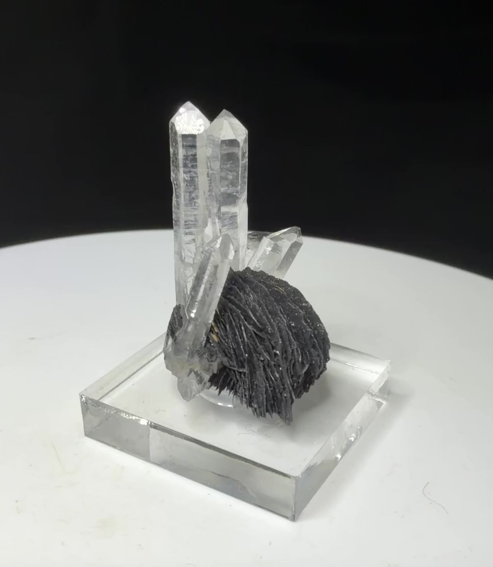 Clear quartz crystals with dark platy hematite from Jinlong Hill, Heyuan, Guangdong, China