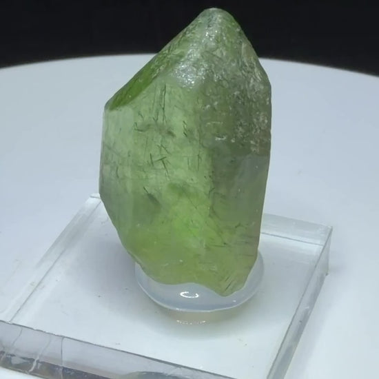 Bright green peridot olivine crystal with ludwigite inclusions from Sapat Gali, Pakistan