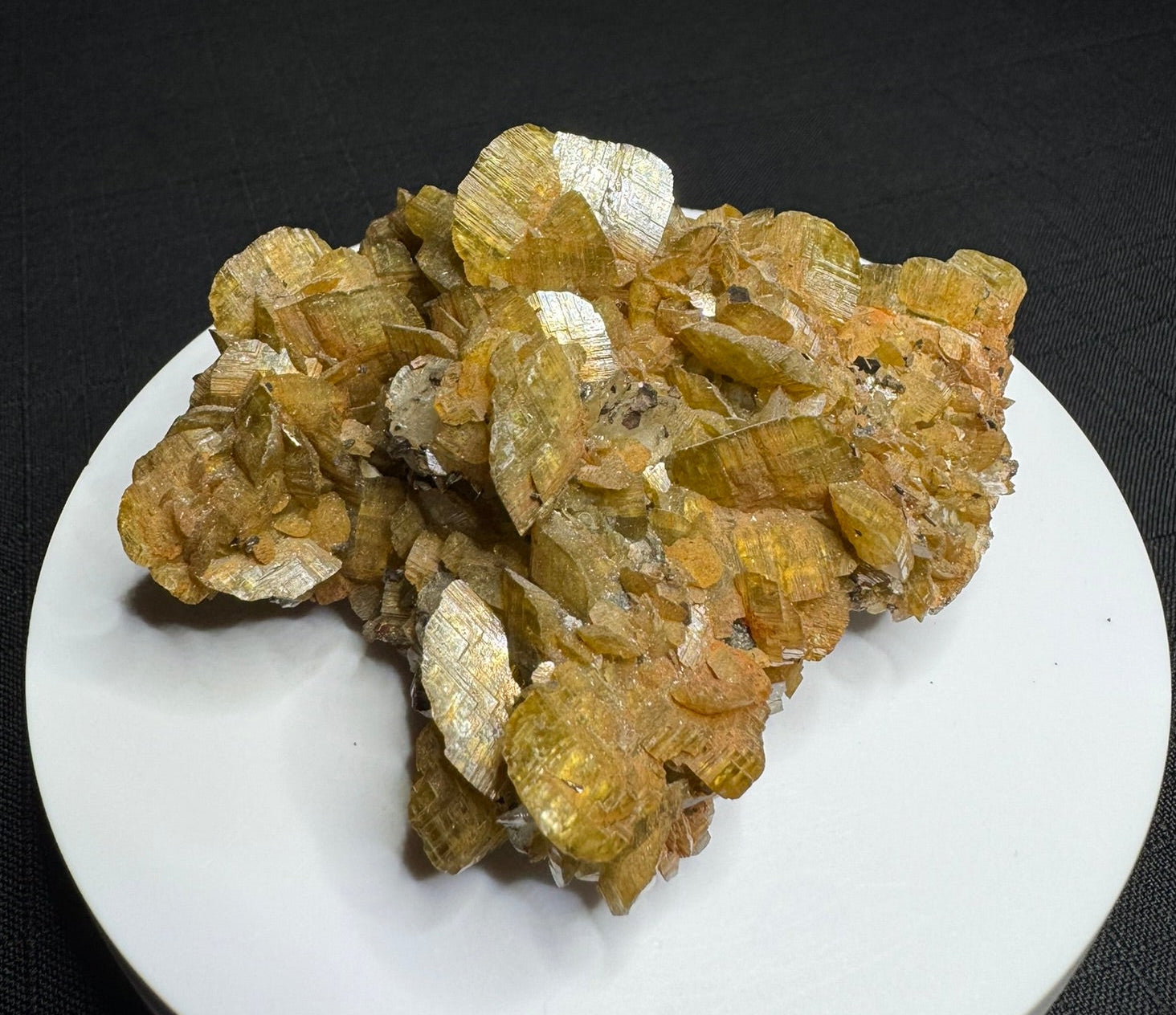 Golden-brown siderite crystal cluster from Morro Velho Mine, Brazil, displayed on a white stand