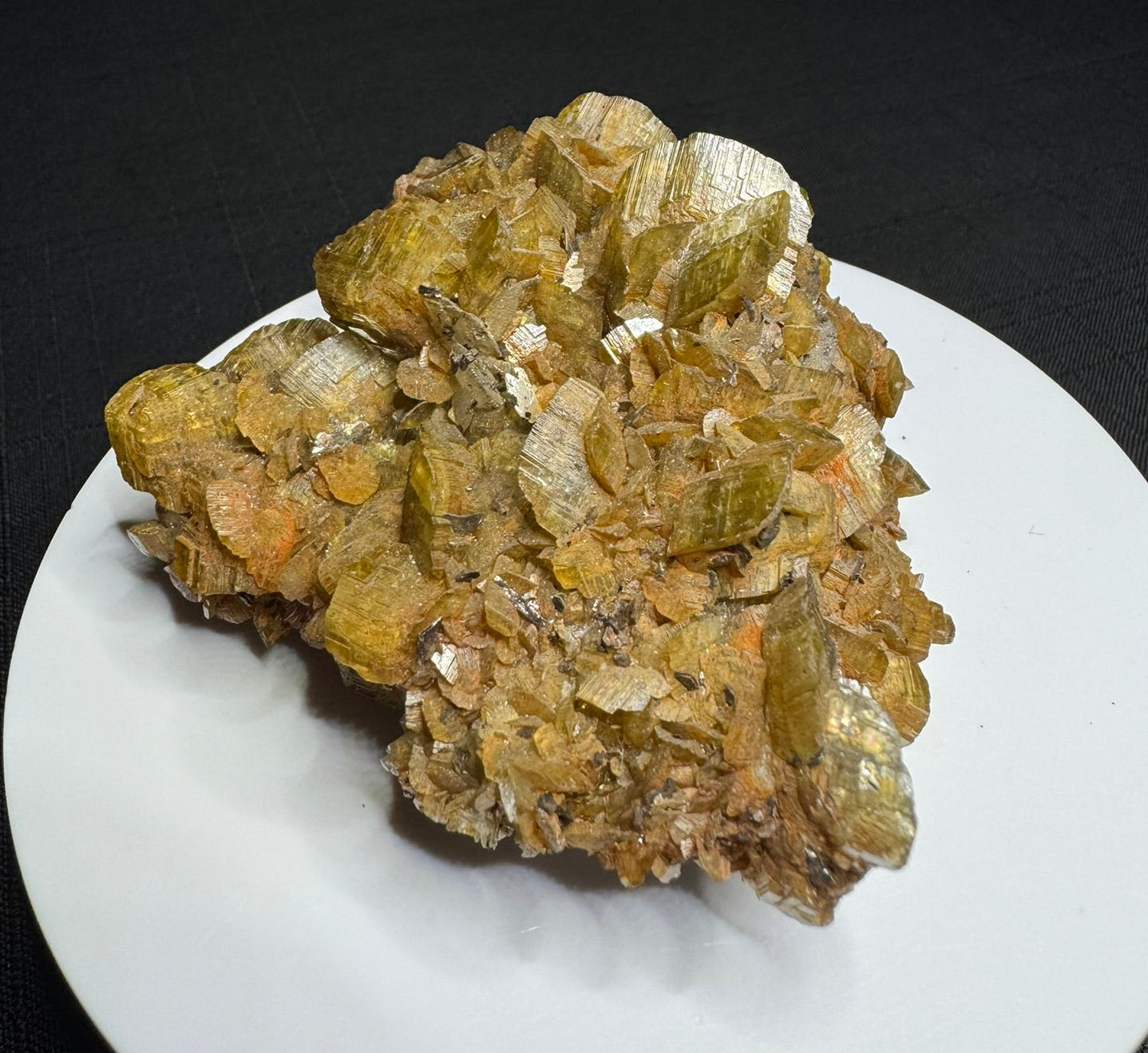Golden-brown siderite crystal cluster from Morro Velho Mine, Brazil, displayed on a white stand