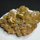 Golden-brown siderite crystal cluster from Morro Velho Mine, Brazil, displayed on a white stand